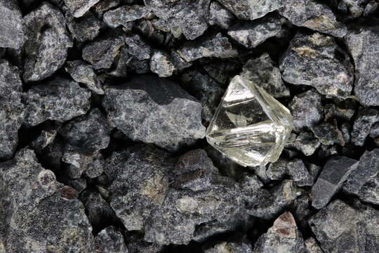 natural 0.55 ct octahedral diamond from South Africa in kimberlite gravel 