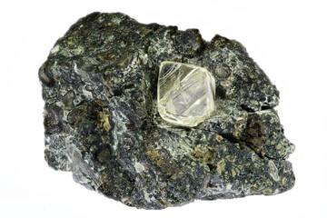 0.55 ct octahedral diamond from South Africa nestled in kimberlite isolated on white background