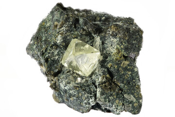 0.55 ct octahedral diamond from South Africa nestled in kimberlite isolated on white background