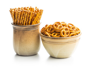 Mini pretzels and salted sticks. Crusty salted snack isolated on white background.