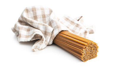 Uncooked whole grain spaghetti. Raw pasta isolated on white background.
