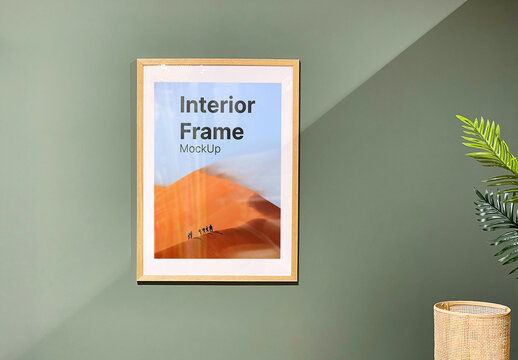 Wooden Photo Frame Mockup on the Green Wall
