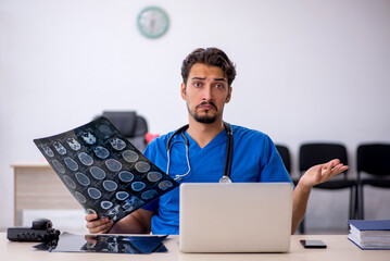 Young male doctor radiologist working in the clinic
