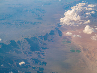 Aerial view of mountain landscape, view from window seat in an airplane