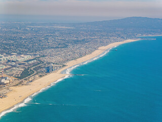 Fototapeta na wymiar Aerial view of the El Segundo Beach and downtown area