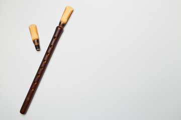 Armenian national musical instrument duduk on color background. Top view