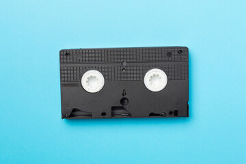 Obraz premium Old analog tape VHS cassette on color background, top view