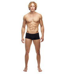 He just oozes masculinity. A full length portrait of a muscular young man, isolated on white.