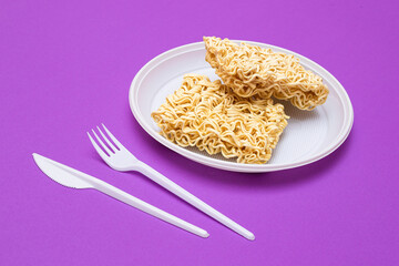 Uncooked Instant Noodles on White Plate. Raw Pasta. Dry Asian Fast Food. Quick Lunch