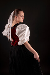 Young beautiful slovak woman in traditional dress. Slovak folklore