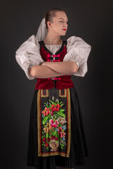 Young beautiful slovak woman in traditional dress. Slovak folklore