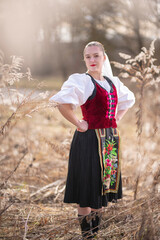 Young beautiful slovak woman in traditional dress. Slovak folklore