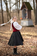 Young beautiful slovak woman in traditional dress. Slovak folklore