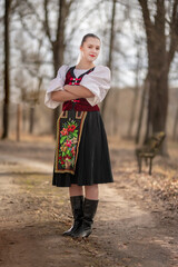Young beautiful slovak woman in traditional dress. Slovak folklore