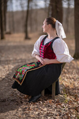 Young beautiful slovak woman in traditional dress. Slovak folklore