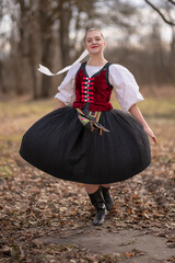 Young beautiful slovak woman in traditional dress. Slovak folklore
