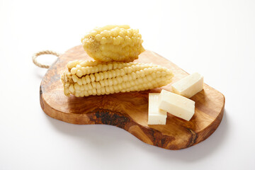 Choclo con queso a typical ecuadorian appetizer that consists of corncob accompanied by fresh...
