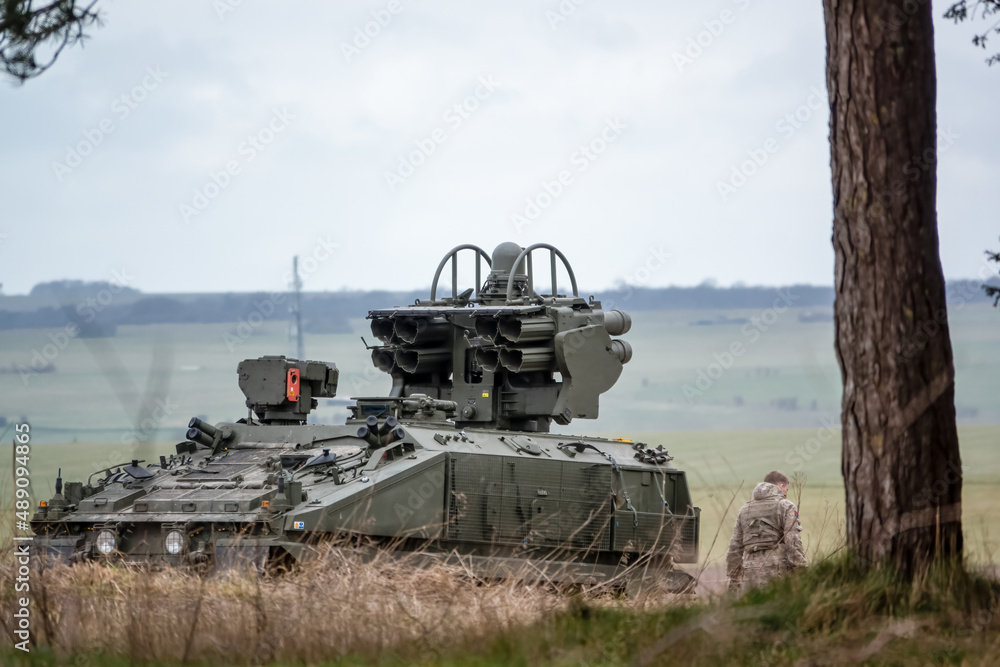 Wall mural British Army Alvis Stormer Starstreak CVR-T tracked armoured vehicle equipped with short range air defense high-velocity missile system in action on a military exercise, Wiltshire UK