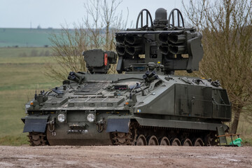 British Army Alvis Stormer Starstreak tracked armoured vehicle equipped with short range air defense high-velocity missile HVM system in action on a military exercise, Wiltshire UK