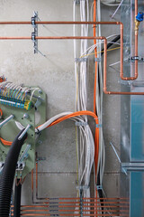Cables and pipes run along the ceiling of the new operating theater building