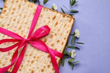 Jewish flatbread for Passover on color background