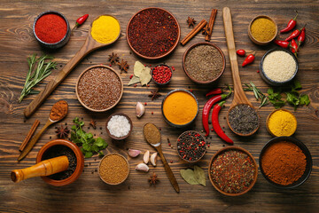 Set of different spices on wooden background