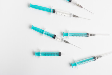 medical syringe with a vaccine isolated on a white background. the concept of vaccination of the population against the virus and diseases