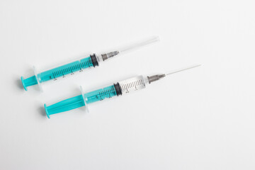 medical syringe with a vaccine isolated on a white background. the concept of vaccination of the population against the virus and diseases