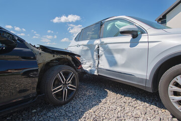 Cars crashed heavily in road accident after collision on city street. Road safety and insurance...