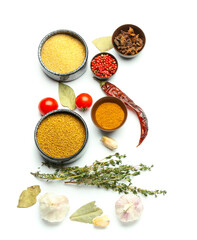 Bowls of different spices and herbs on white background