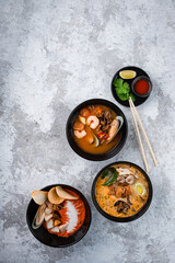 Tom Yum and Tom Kha traditional Thai soups with seafood, chicken, coconut milk and hot spices