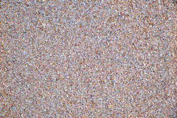 Flat view of clean yellow sand surface covering seaside beach. Sandy texture