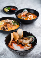 tomato soup with seafood. Tomato gazpacho soup with mussels, squid, shrimp in bowl