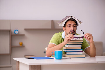 Young male student studying at home