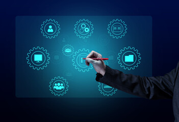Fototapeta premium Control and management of business processes in the enterprise for efficient operation and increased profits. Concept with manager's hand and gears on holographic screen