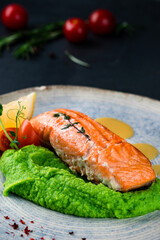 Red fish piece with green pea puree