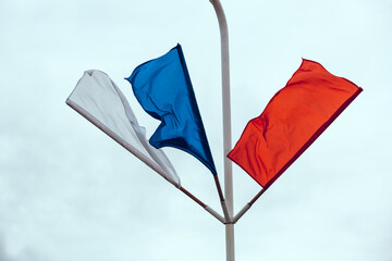 Russian flag on a white background. Flags of Russia flying in the wind. Red, white, blue flags. May 9 Victory Day