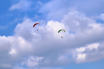 two Paragliders in the clouds