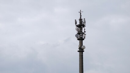 Fototapeta na wymiar telecommunication tower, telephone antenna against sky