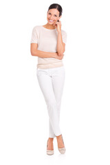 Fototapeta premium Shes everybodys woman. Studio portrait of a casually dressed young woman isolated on white.