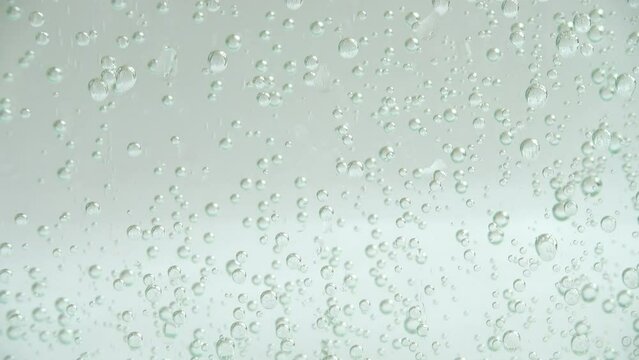 Air bubbles of the fizzy water.