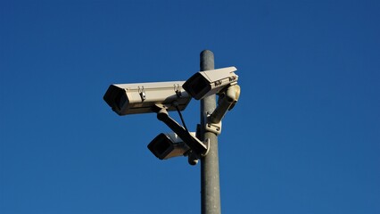 urban video surveillance cameras against sky