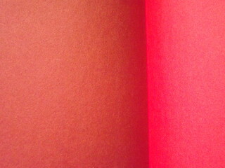 Fototapeta premium Burgundy, crimson, red, pink paper surface with a clear separation of colors as a background. High quality photo