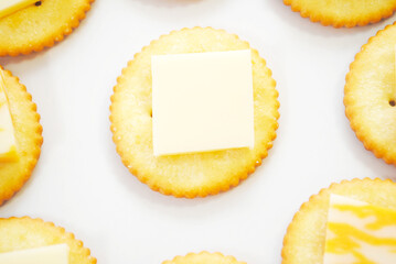 Round Salty Crackers with Sliced Cheese on Top