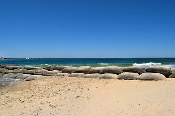 View on the ocean and Maroochydore bay with breakwater made od sandbags as procetction against...