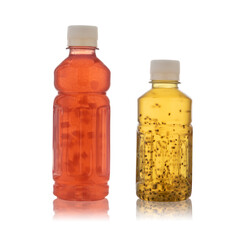 drink in a plastic bottle with chia seeds and slices of watermelon and strawberries