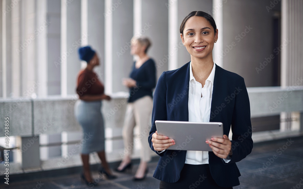 Poster portable tech keeps me productive wherever i go. shot of a young businesswoman using a digital table