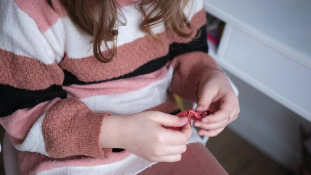 Creative Gifted Young Caucasian Girl Sewing and Stiching Hand Made Decoration Gadget Accessory using Needle and Thread