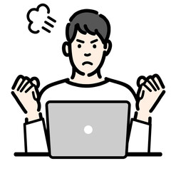 ラップトップの前で怒っている若い男性
