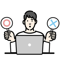 マルバツの札を持って考えている若い男性
